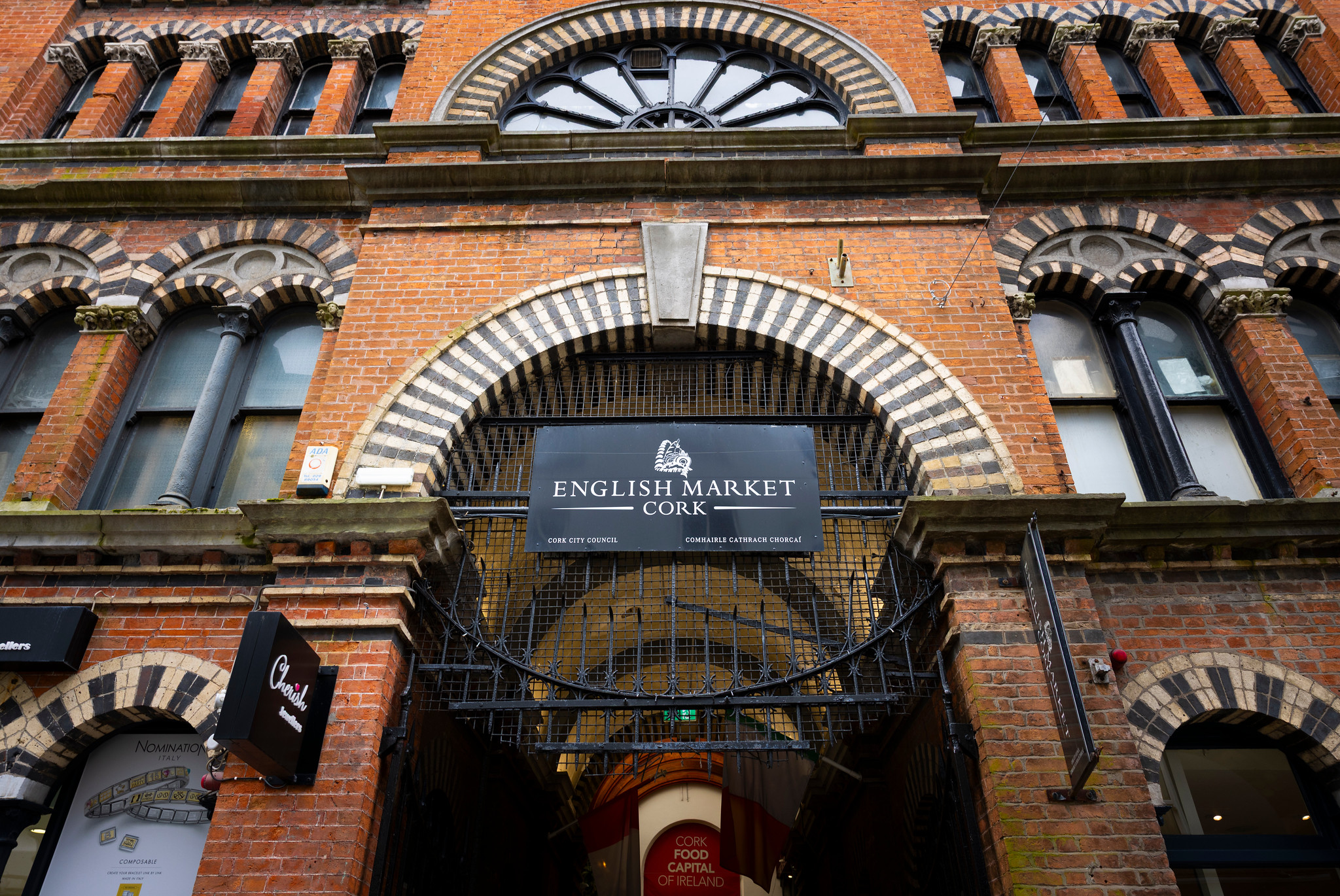 Brick fa&ccedil;ade and arched Princes Street entrance to Cork's English Market.